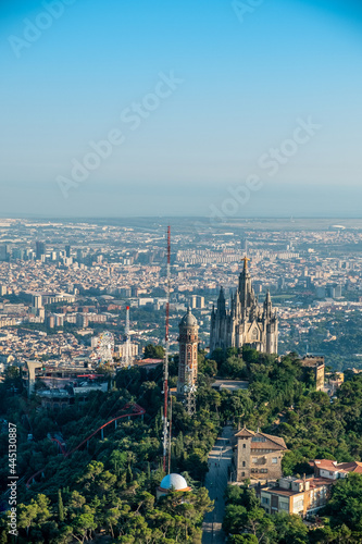 Aerial views of the Tibidabo mountain from the helicopter in the city of Barcelona, catalonia