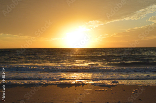 Beautiful golden sunset on Naples beach, South Florida, USA © hippomyta