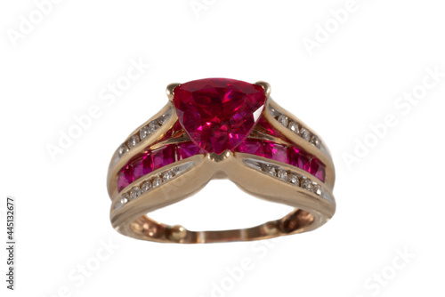 Yellow gold ring with rubies and diamonds, isolated on a white background