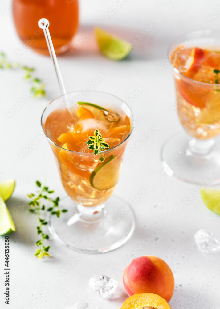 Homemade fresh apricot cocktail with ice, lime and lemon thyme. Refreshing, homemade non-alcoholic cocktails in summer. Selective focus. Copy space. Homemade fresh apricot cocktail with ice, lime and lemon thyme. Refreshing, homemade non-alcoholic cocktails in summer. Selective focus. Copy space.