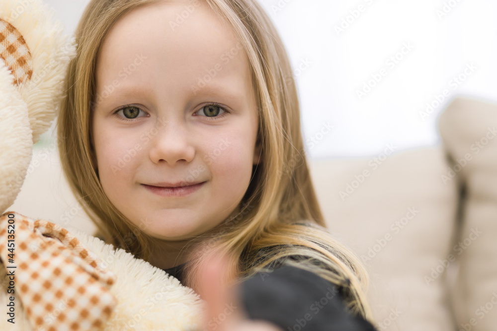 Cropped photo of blonde girl showing thumb up. Cropped photo of blonde girl showing thumb up.