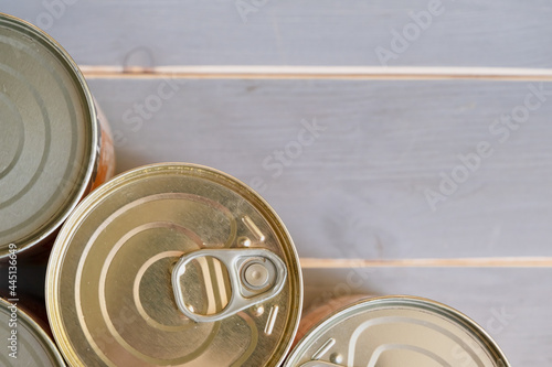 Tin cans of food. Several aluminum cans with long-term storage. View from above.