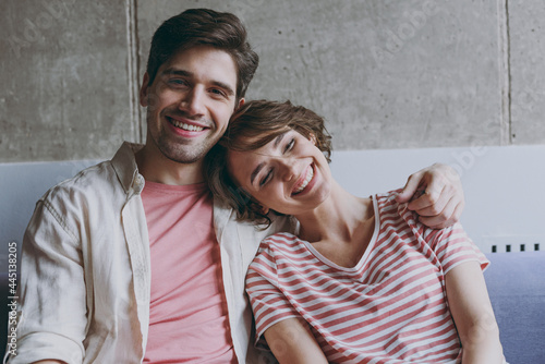 Schilderij op canvas Young smiling satisifed happy couple two friend woman man 20s in striped tshirt