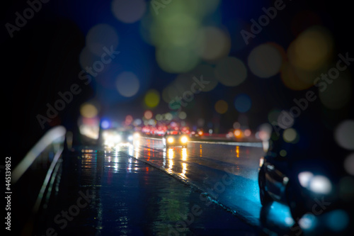 colorful traffic in the city on rainy night