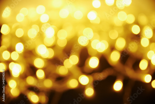 Golden colored blurred background. Abstract background with bokeh.