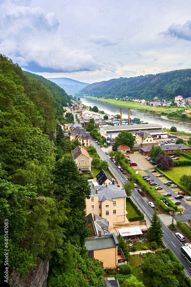 Aerial view of Bad Schandau in Germany at the river Elbe at the edge of Saxon Switzerland, arterial road with parking lots and commercial enterprises