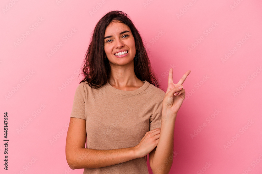 Young caucasian woman isolated on pink background showing number two with fingers. Young caucasian woman isolated on pink background showing number two with fingers.