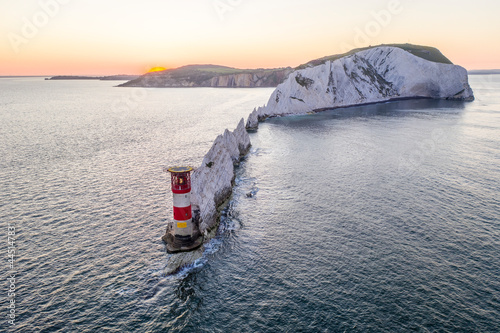 The Needles Isle of Wight with The Needles Lighthouse taken from the air at dawn with a still sea and crisp light.