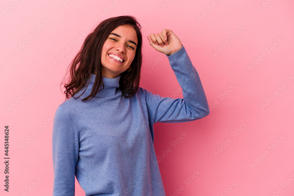 Young caucasian woman isolated on pink background celebrating a victory, passion and enthusiasm, happy expression. Young caucasian woman isolated on pink background celebrating a victory, passion and enthusiasm, happy expression.