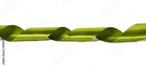 Fotografie swirling green silk ribbon on white background, gift wrapping decor