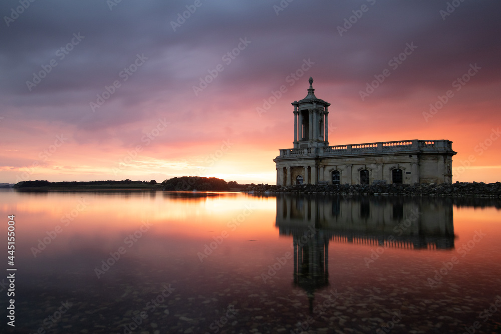 Sunset over a lake and church