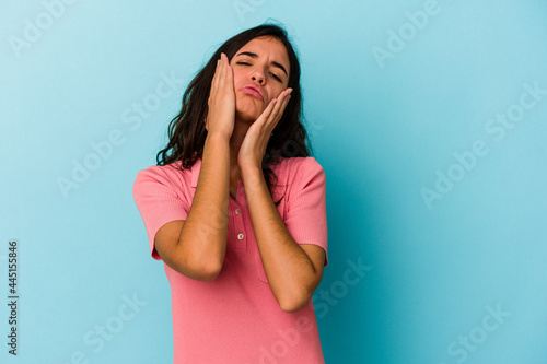 Young caucasian woman isolated on blue background whining and crying disconsolately. © Asier