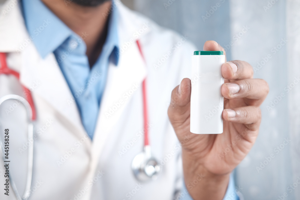 doctor hand holding artificial sweetener container doctor hand holding artificial sweetener container