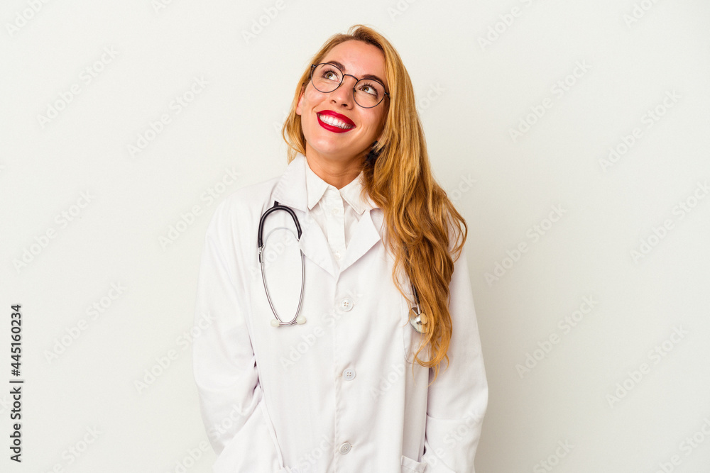 Caucasian doctor woman isolated on white background dreaming of achieving goals and purposes Caucasian doctor woman isolated on white background dreaming of achieving goals and purposes
