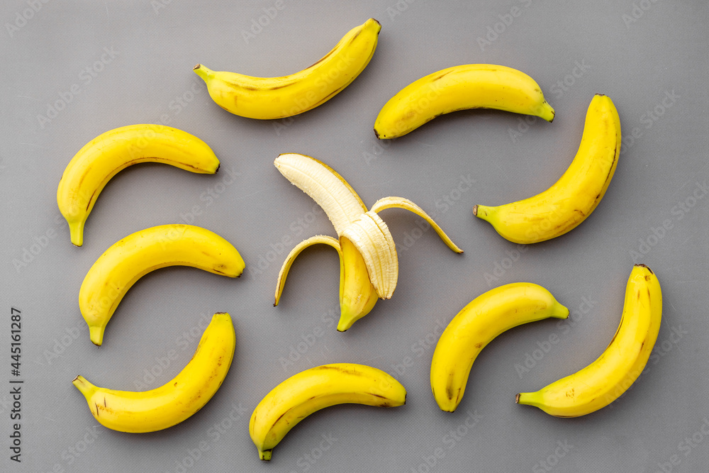 Half peeled banana with other fruits. Top view Half peeled banana with other fruits. Top view