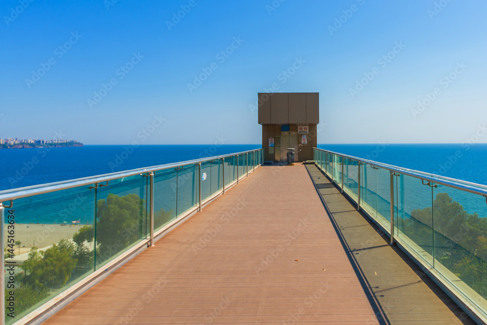 ANTALYA, TURKEY: View of Konyaalti beach and elevator in summer in Antalya. ANTALYA, TURKEY: View of Konyaalti beach and elevator in summer in Antalya.