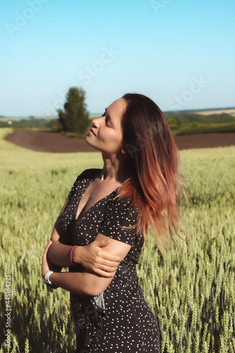 Russian girl in a field with wheat - here she is real freedom