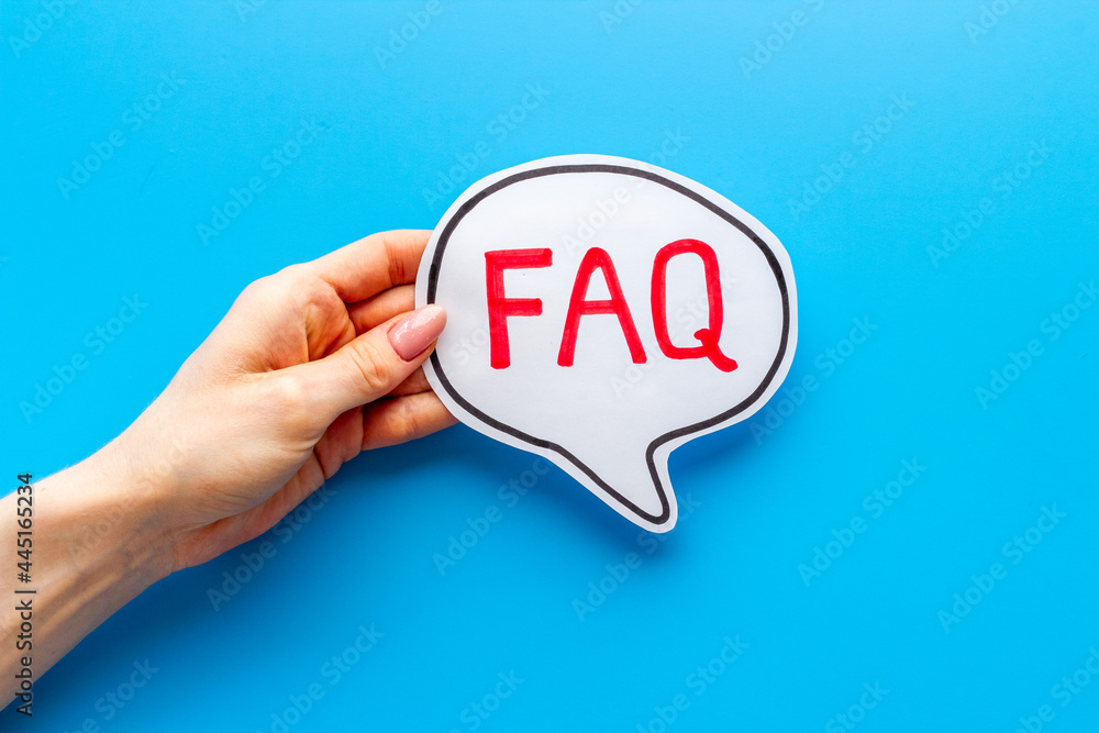 Hands with faq word on paper bubble. Frequently asked questions concept Hands with faq word on paper bubble. Frequently asked questions concept