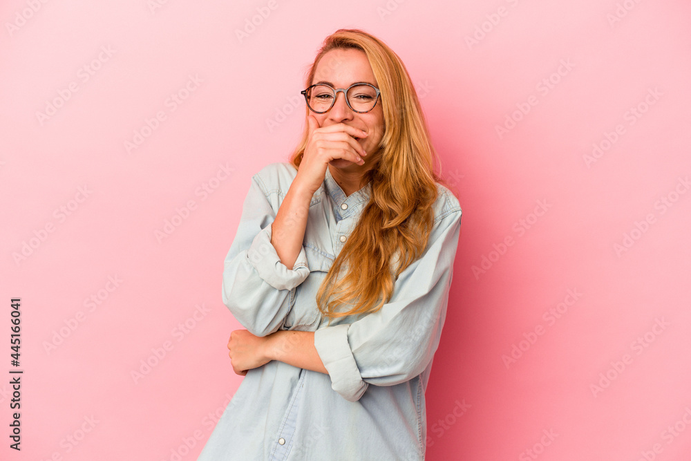 Caucasian blonde woman isolated on pink background laughing happy, carefree, natural emotion. Caucasian blonde woman isolated on pink background laughing happy, carefree, natural emotion.