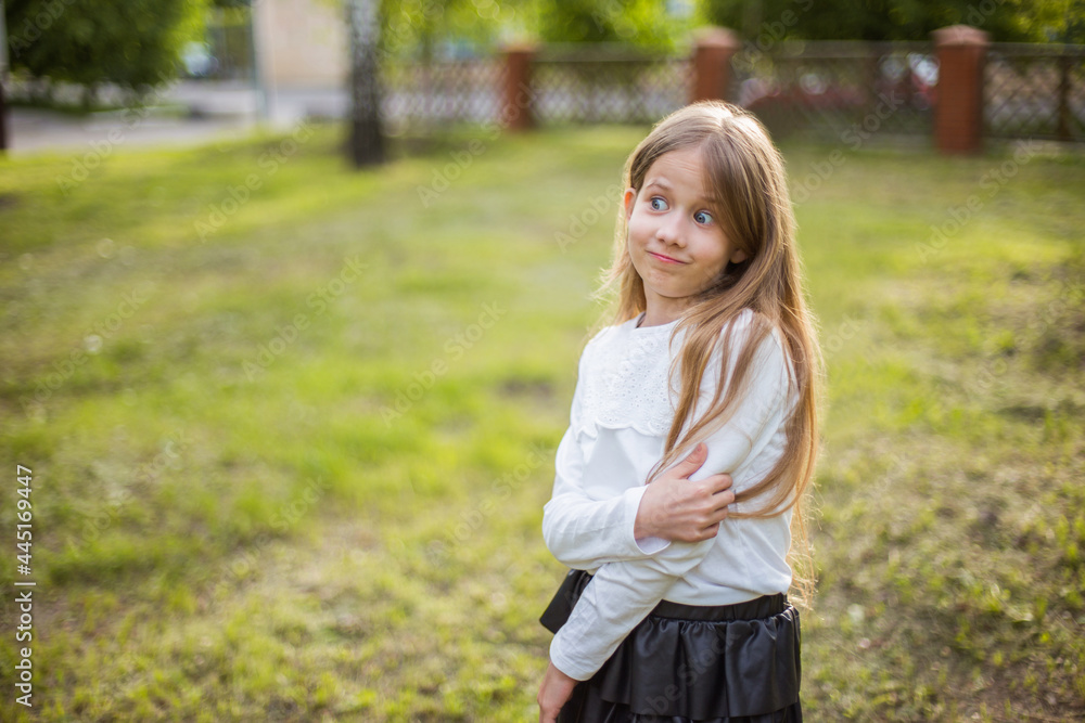 beautiful girl in a white blouse in nature in sunlight beautiful girl in a white blouse in nature in sunlight