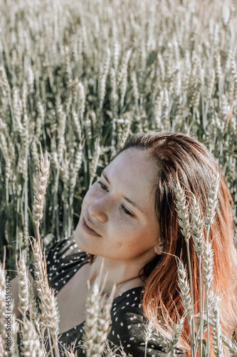Russian girl in a field with wheat - here she is real freedom