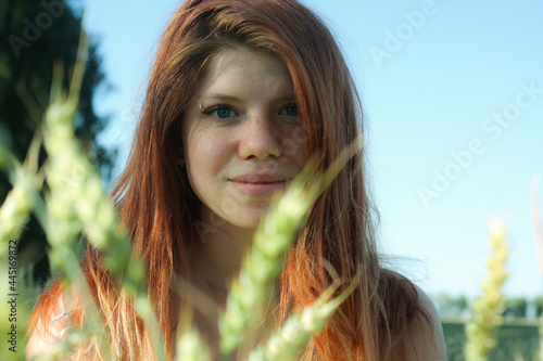 Russian girl in a field with wheat - here she is real freedom