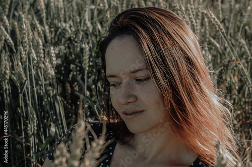 Russian girl in a field with wheat - here she is real freedom