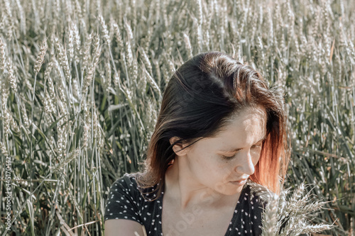 Russian girl in a field with wheat - here she is real freedom