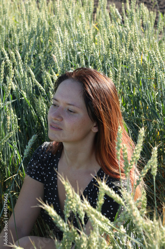 Russian girl in a field with wheat - here she is real freedom