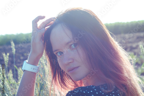 Russian girl in a field with wheat - here she is real freedom