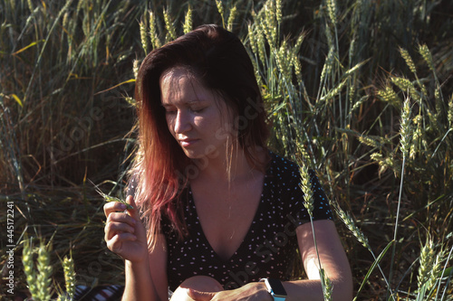 Russian girl in a field with wheat - here she is real freedom