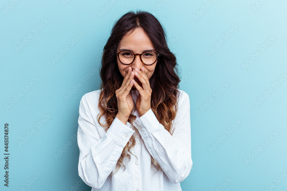 Young mexican woman isolated on blue background making up plan in mind, setting up an idea. Young mexican woman isolated on blue background making up plan in mind, setting up an idea.