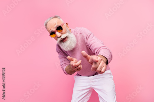 Photo of cool grey beard hair old man point you wear eyewear sweater isolated on pink background photo