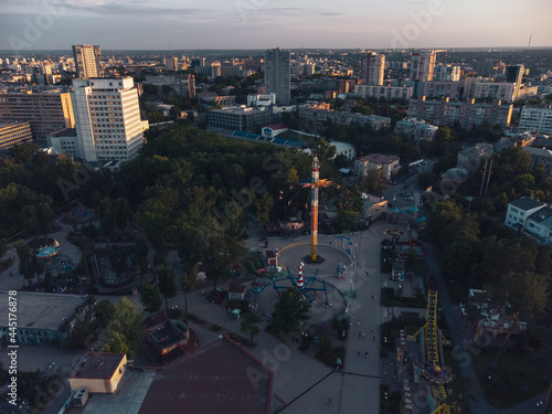 Attractions recreation area in sunset light. Aerial evening view in Kharkiv city center Park of Maxim Gorky