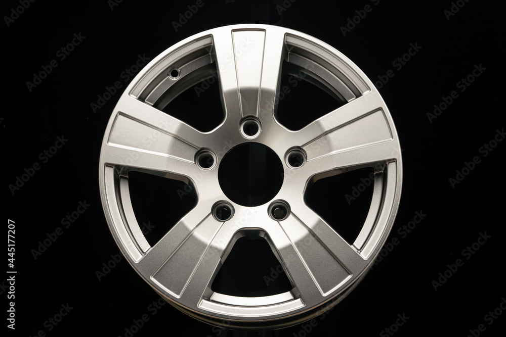 Obraz premium new silver alloy wheels for SUVs on black background
