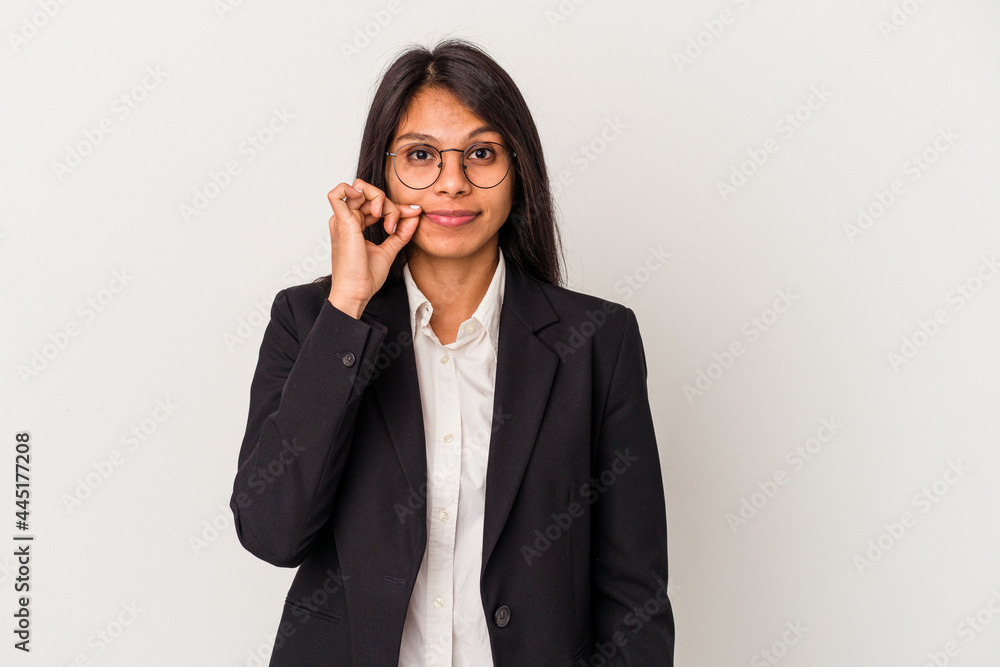 Young business latin woman isolated on white background with fingers on lips keeping a secret. Young business latin woman isolated on white background with fingers on lips keeping a secret.