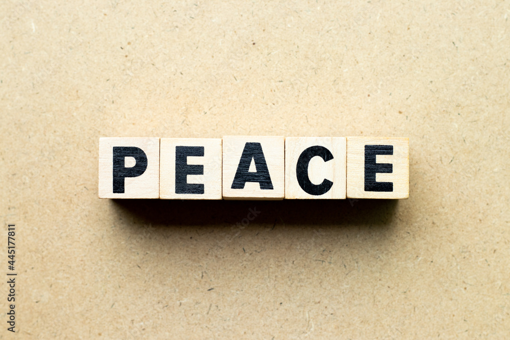 Obraz premium Alphabet letter block in word peace on wood background