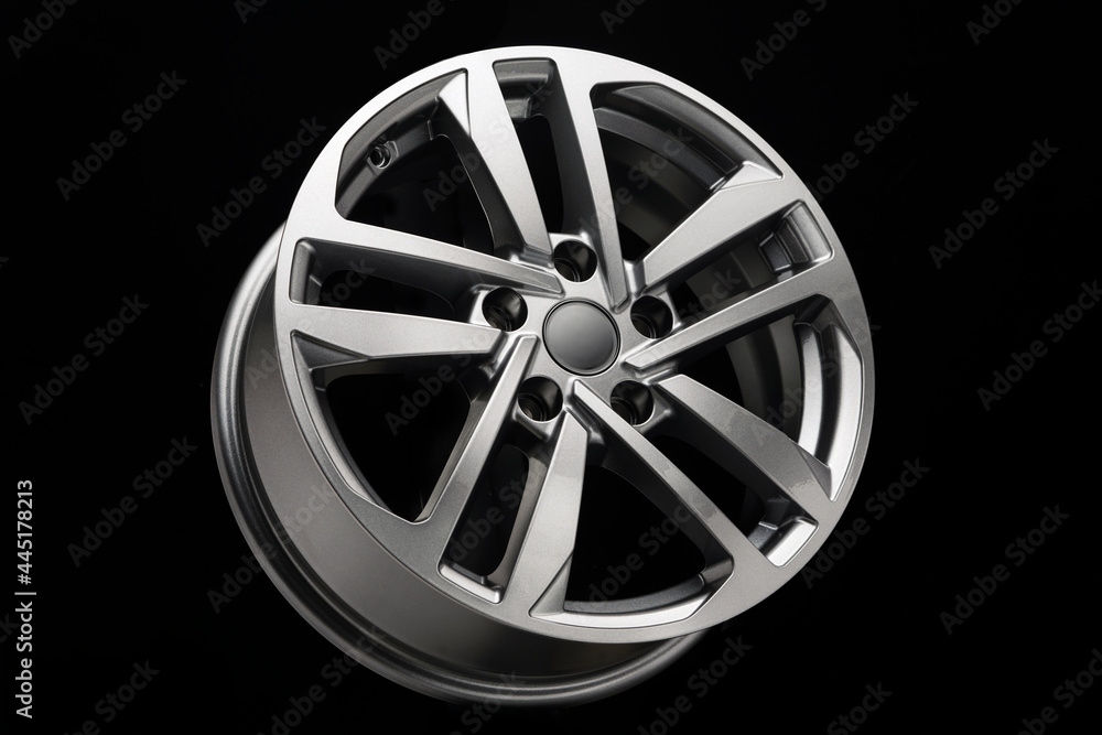 Obraz premium grey modern alloy wheel side view on black background