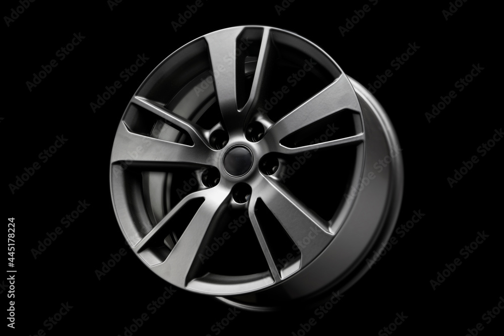 Obraz premium black matte fashion alloy wheel, a product for car tuning. close up