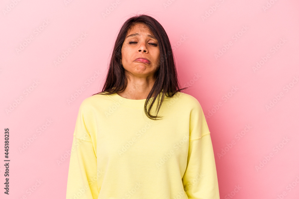 Young latin woman isolated on pink background sad, serious face, feeling miserable and displeased. Young latin woman isolated on pink background sad, serious face, feeling miserable and displeased.
