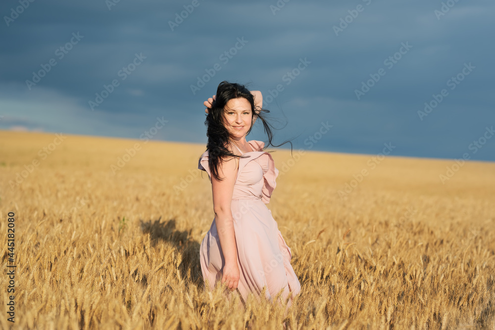 happy Girl with long black hair in a wheat field. happy Girl with long black hair in a wheat field.