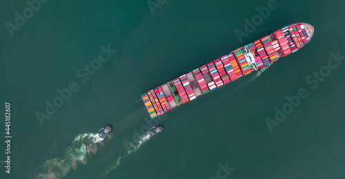 tug ship drag container cargo smart ship vessel to cargo international container yard port concept shipping by sea. © Yellow Boat