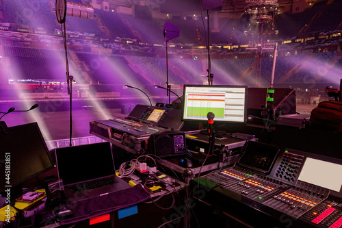 Music director's console at concert venue. Sound engineer workplace. Control room for sound control. Equipment for a sound director. Music studio. Music operator room inside stadium.