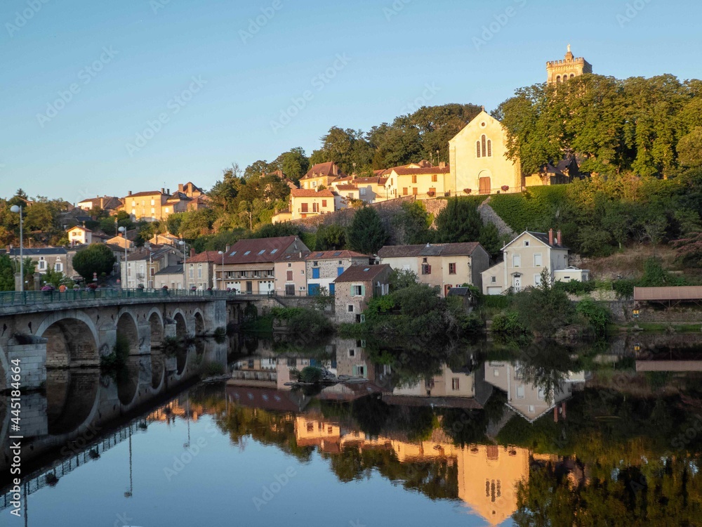 beautiful reflections of old French houses and wash house in the river at L'isle Jourdain France