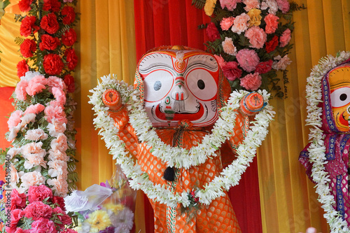 Idols of God Balaram. Lord Balaram , brother of Lord Jagannath is being worshipped with garlands for Rath jatra festival - at Howrah, West Bengal, India. photo