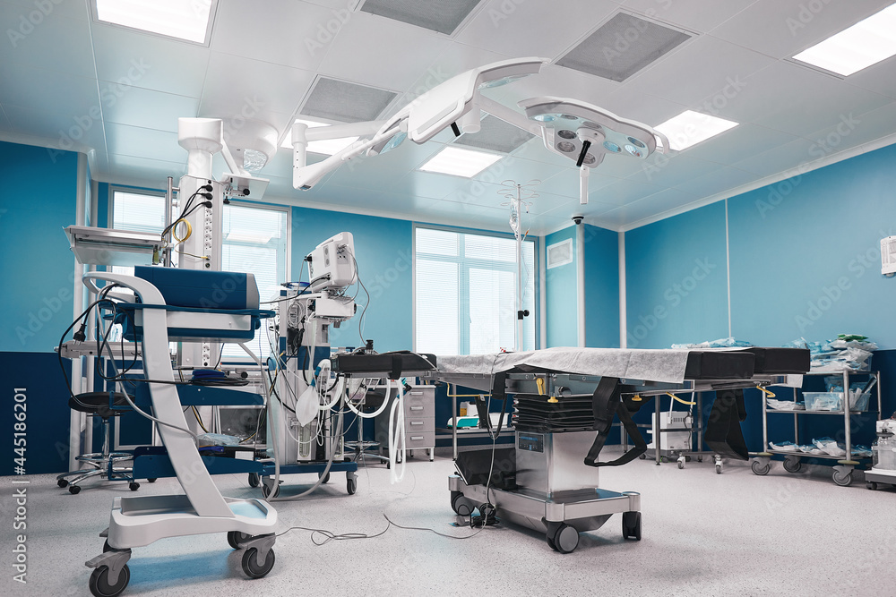 Fototapeta premium Large spacious operating board with a large amount of light, with modern equipment for various complex operations, operating table, lamps, ventilator.