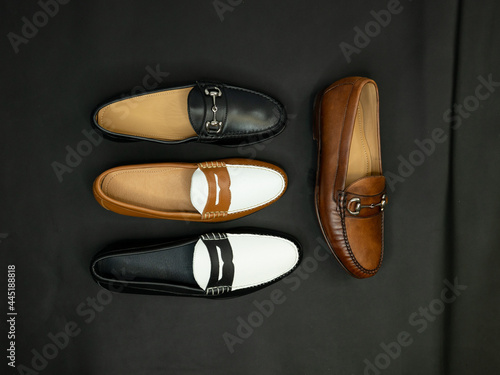 фотографія Penny and bit loafers on a dark black background