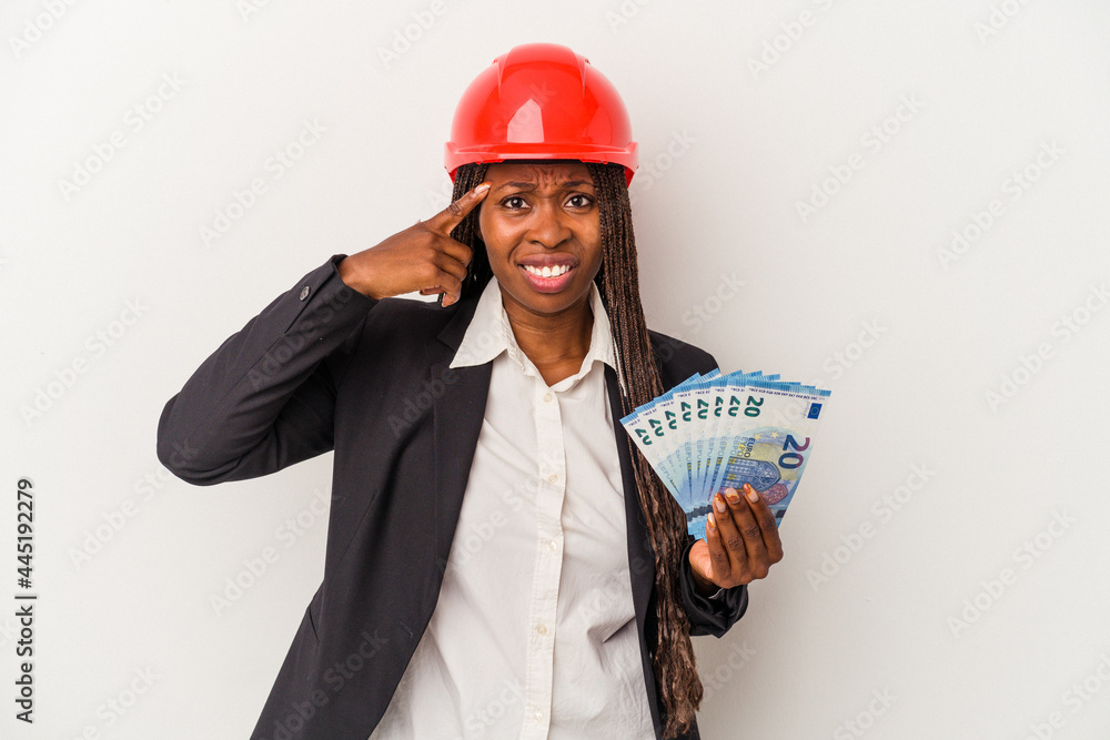 Young african american architect woman holding bills isolated on white background showing a disappointment gesture with forefinger. Young african american architect woman holding bills isolated on white background showing a disappointment gesture with forefinger.
