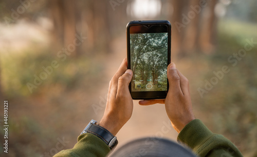 Photography Man taking photo by phone, Mobile photographer clicking nature