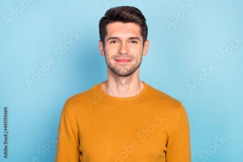 Photo of young handsome business man happy positive smile wear casual jumper isolated over blue color background